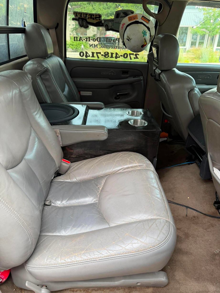 Custom center console subwoofer enclosure in a GMC Denali